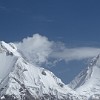 Dreamland for the mountaineers. To the right the massive marble pyramid of Khan-Tengri. Khan Tengri's geologic elevation is 6,995 m but its glacial cap rises to 7,010 m. For this reason, it is considered a 7000m peak.